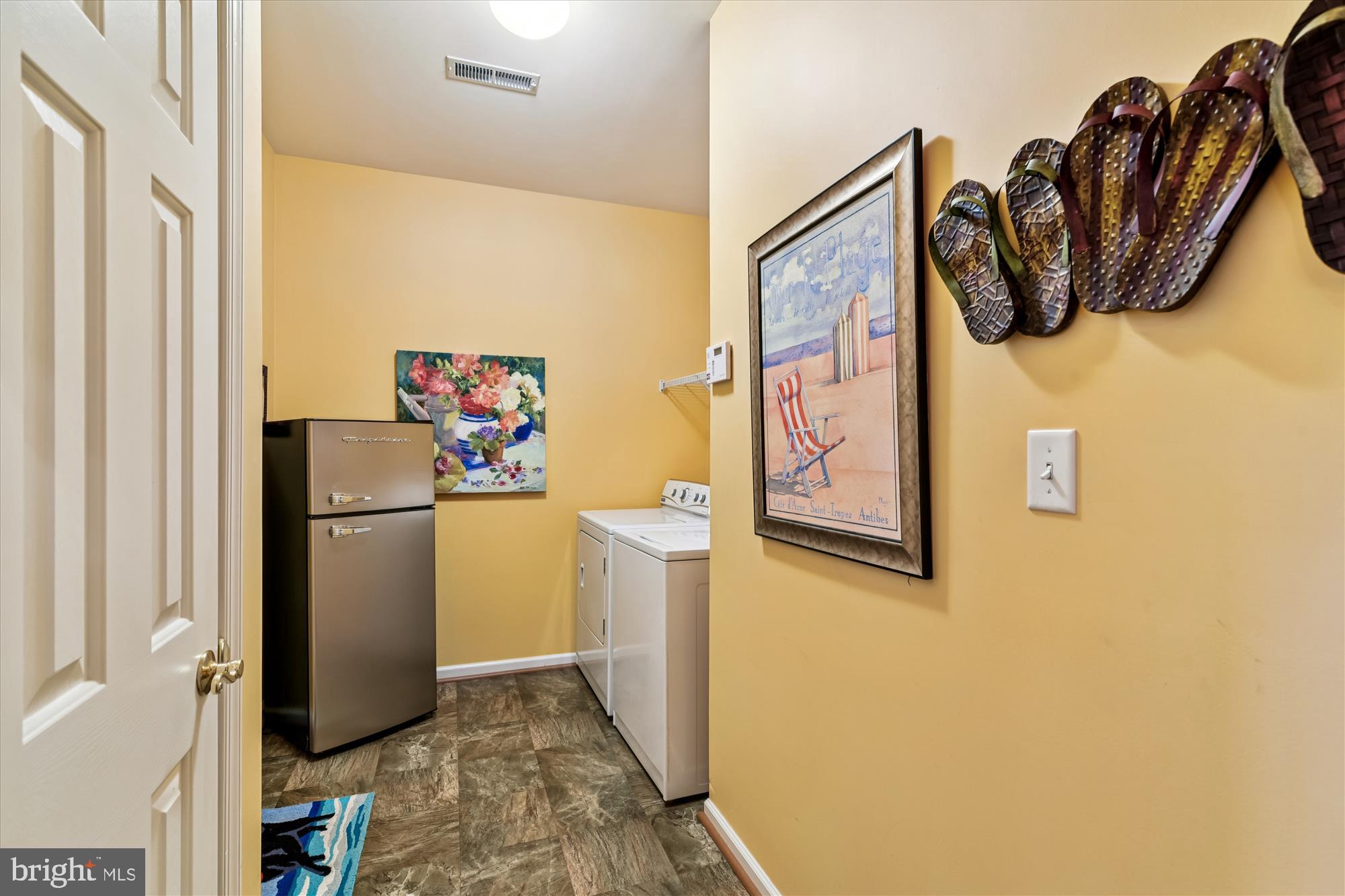 9 Brighton Street Ocean View, DE 19970 - Photo 23 of 48 a white refrigerator freezer sitting inside of a kitchen