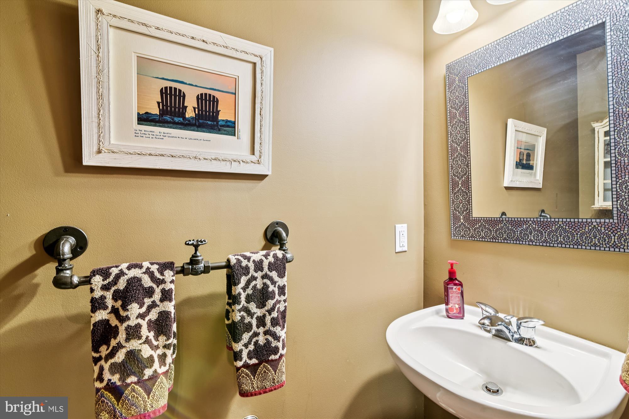 9 Brighton Street Ocean View, DE 19970 - Photo 34 of 48 a bathroom with a sink and mirror