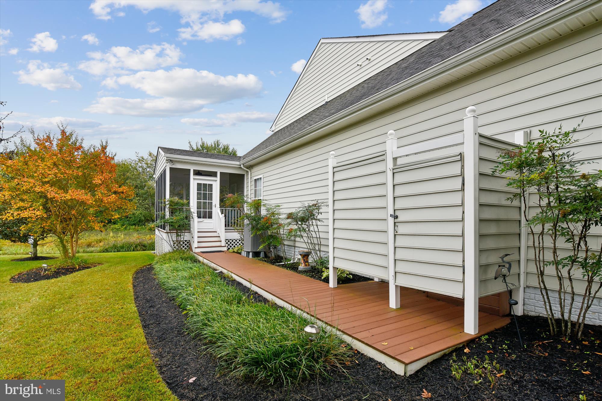 9 Brighton Street Ocean View, DE 19970 - Photo 4 of 48 a view of a backyard with plants and a patio