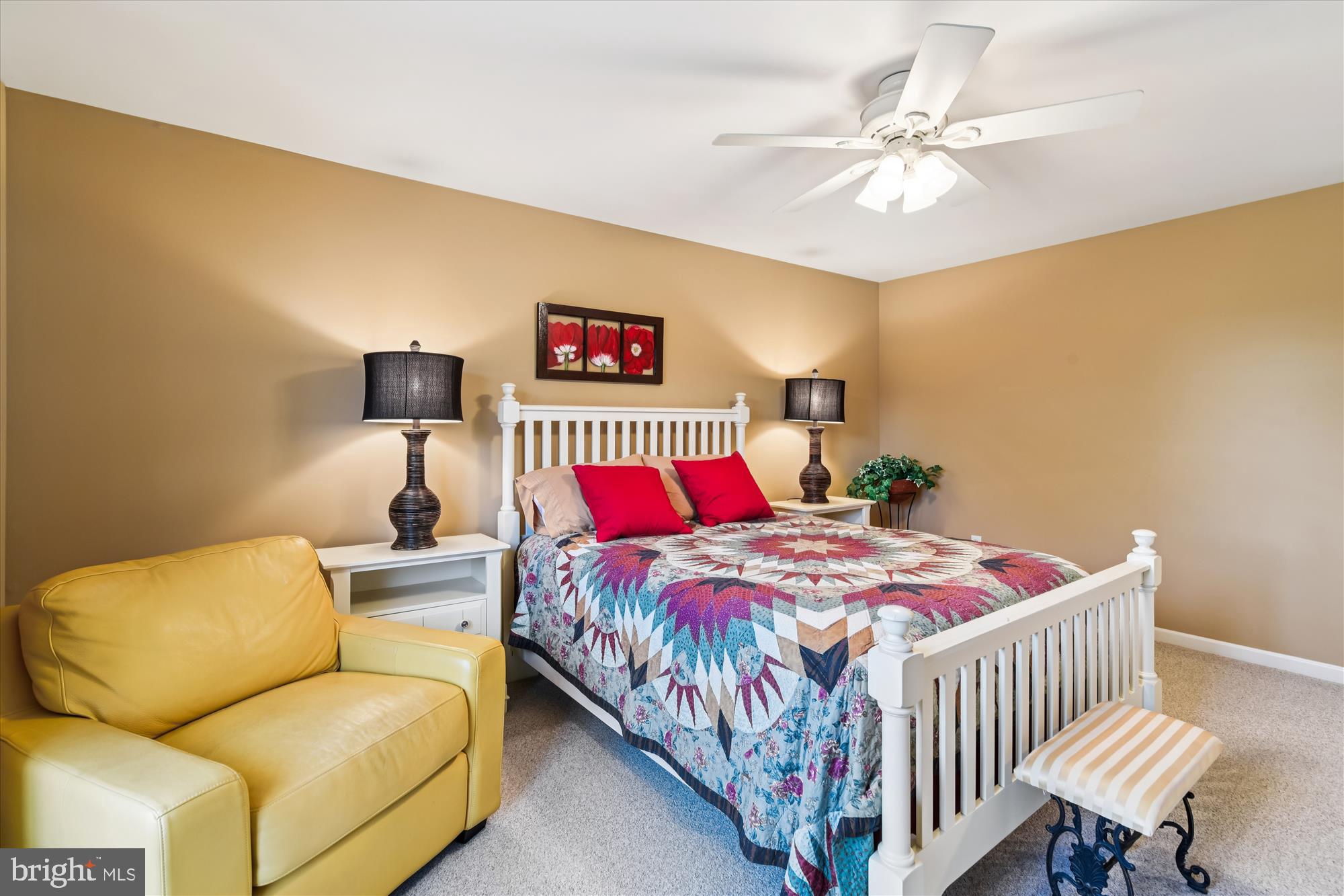 9 Brighton Street Ocean View, DE 19970 - Photo 43 of 48 a bedroom with a bed and a chandelier