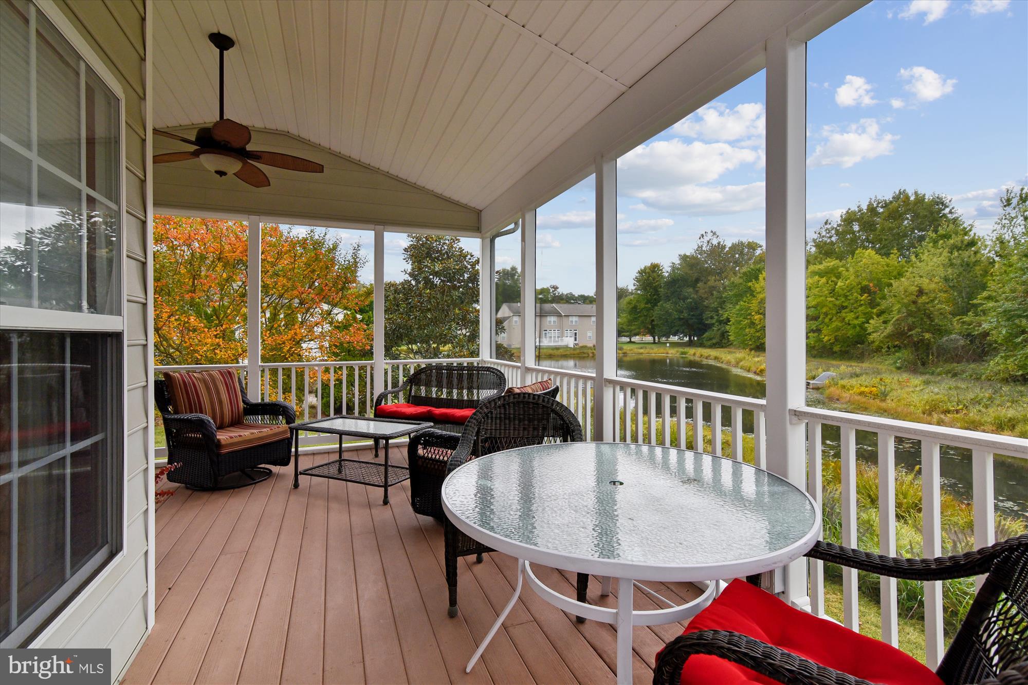 9 Brighton Street Ocean View, DE 19970 - Photo 9 of 48 a balcony with furniture and wooden floor