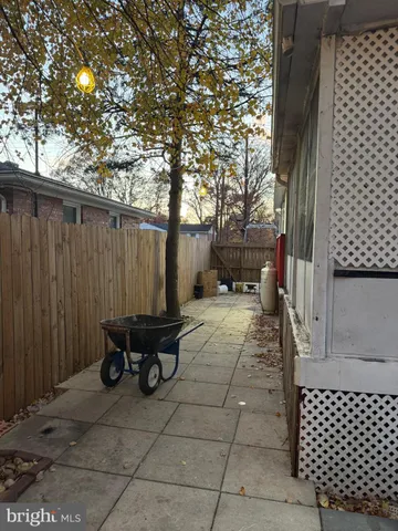 a view of balcony with wooden floor and iron fence