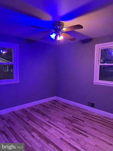 a view of a chandelier fan and window