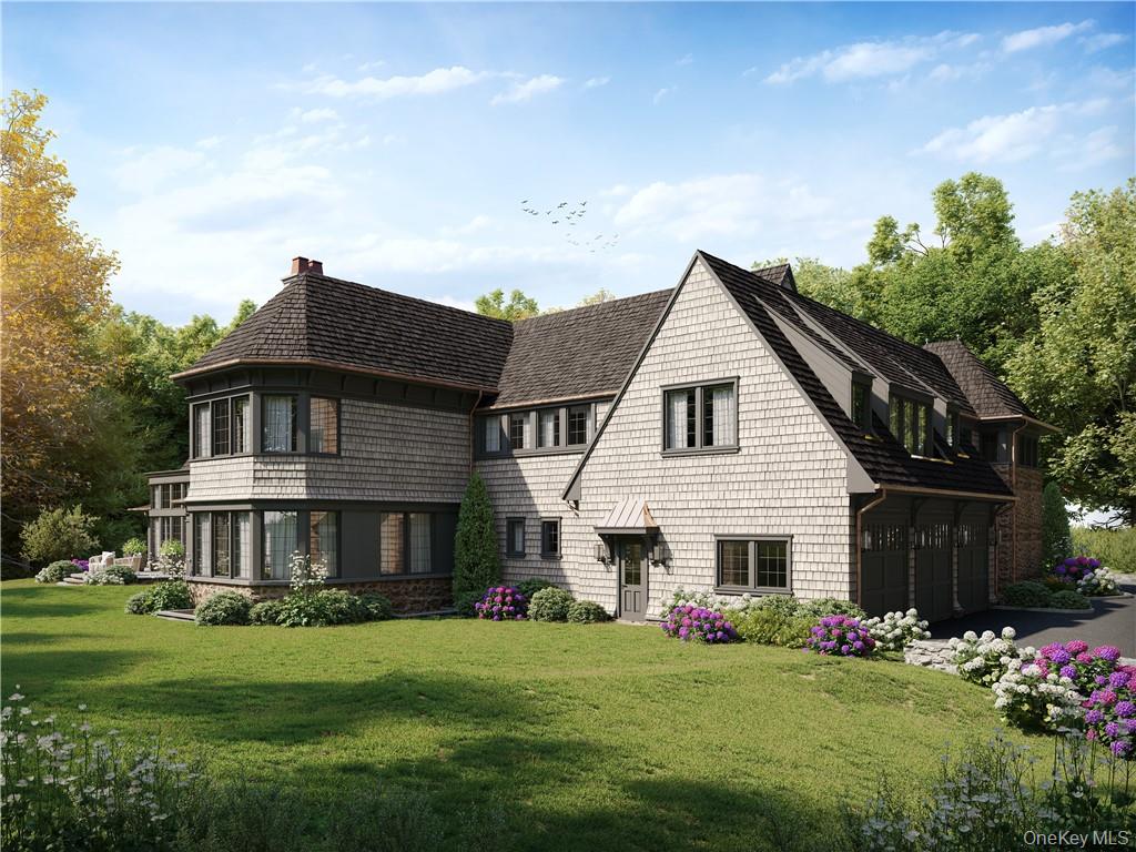 255 Grace Church Street Rye, NY 10580 - Photo 2 of 7 a front view of a house with a garden