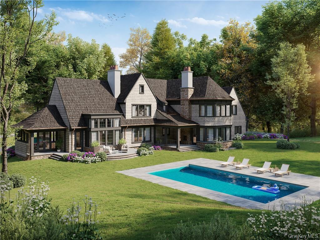 255 Grace Church Street Rye, NY 10580 - Photo 3 of 7 a front view of a residential houses with yard and green space