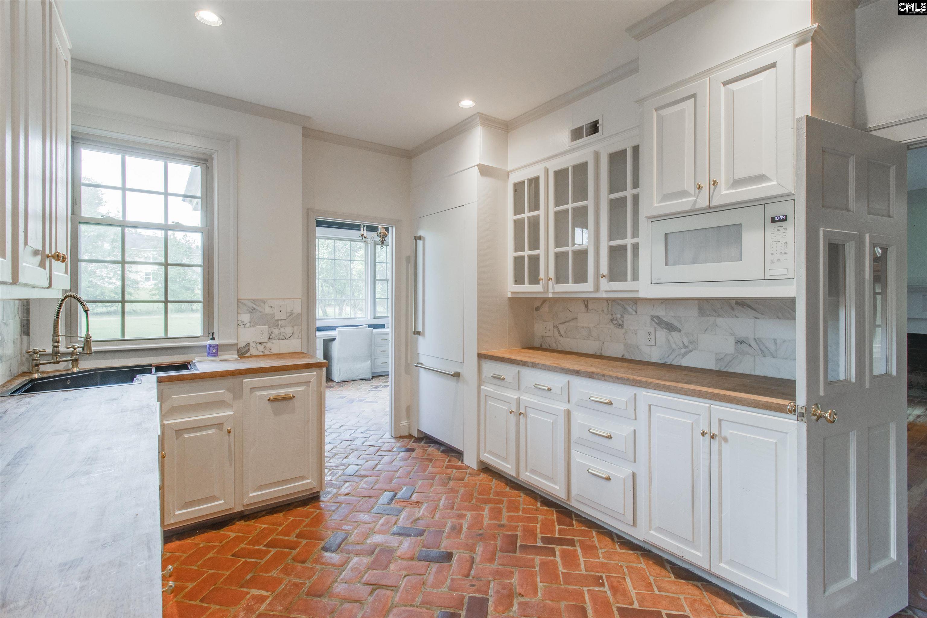 701 Longtown Road Columbia, SC 29229 - Photo 17 of 26 a large kitchen with granite countertop a stove and a sink