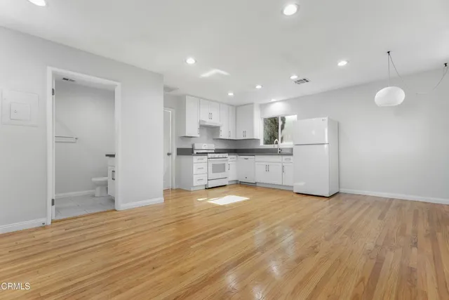 a view of kitchen with wooden floor