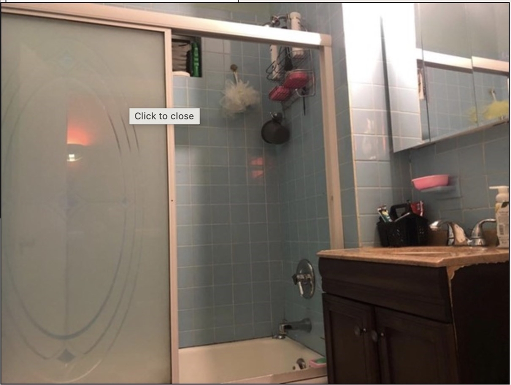 121 Main Street, Unit 1 Malden, MA 02148 - Photo 3 of 5 a bathroom with a sink vanity mirror and toilet