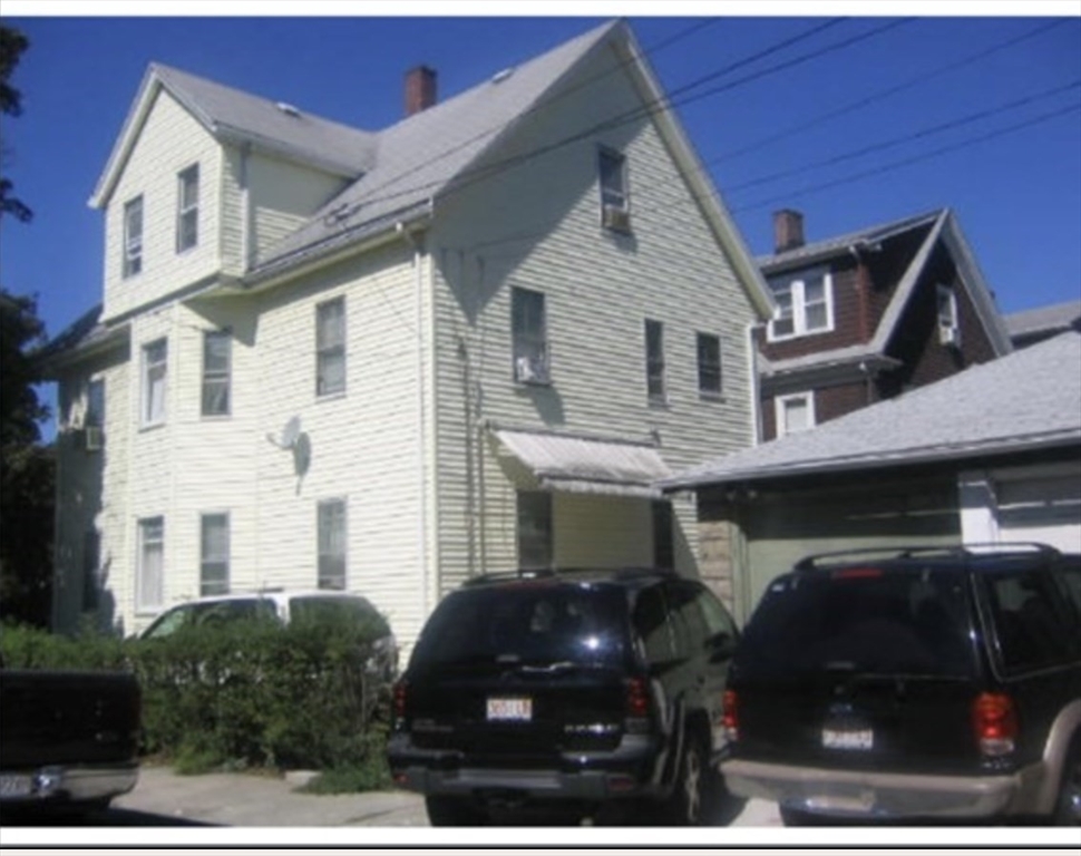 121 Main Street, Unit 1 Malden, MA 02148 - Photo 5 of 5 a couple of cars parked in front of a building