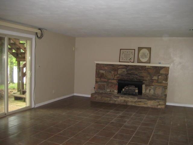 1296 Loggers Road Goodview, VA 24095 - Photo 14 of 15 a living room with furniture and a fireplace