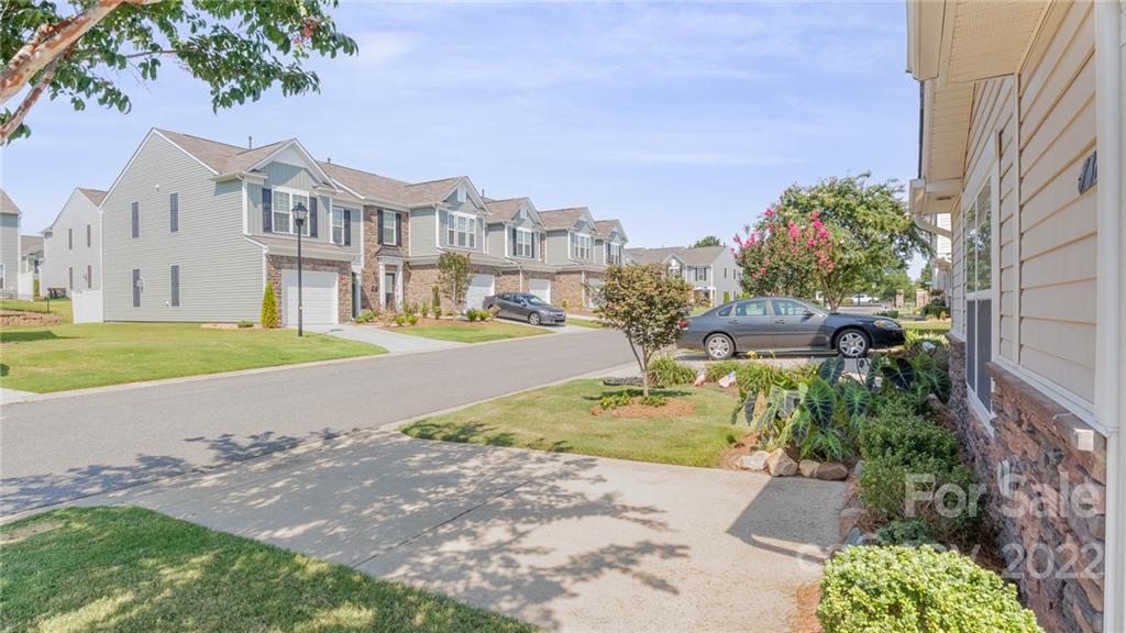 736 Elders Story Road, Unit 116 Fort Mill, SC 29708 - Photo 3 of 29 a view of a city with tall buildings and a big yard
