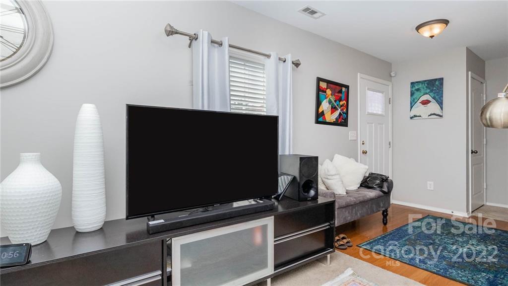 736 Elders Story Road, Unit 116 Fort Mill, SC 29708 - Photo 6 of 29 a living room with furniture and a flat screen tv