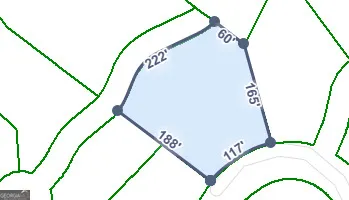 a view of staircase with railing and white walls