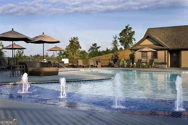 a view of a lake with sitting area