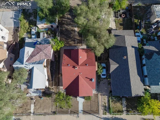 an aerial view of houses with outdoor space