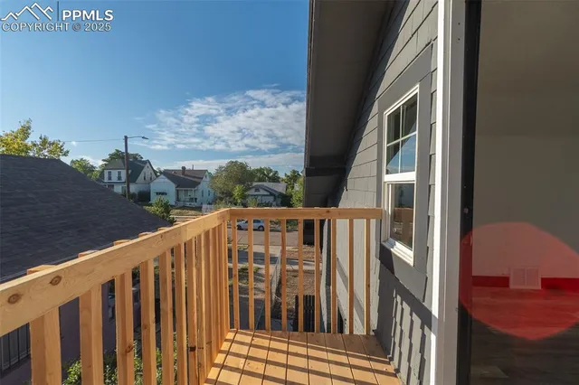 a view of a room with rack on the wall and a window