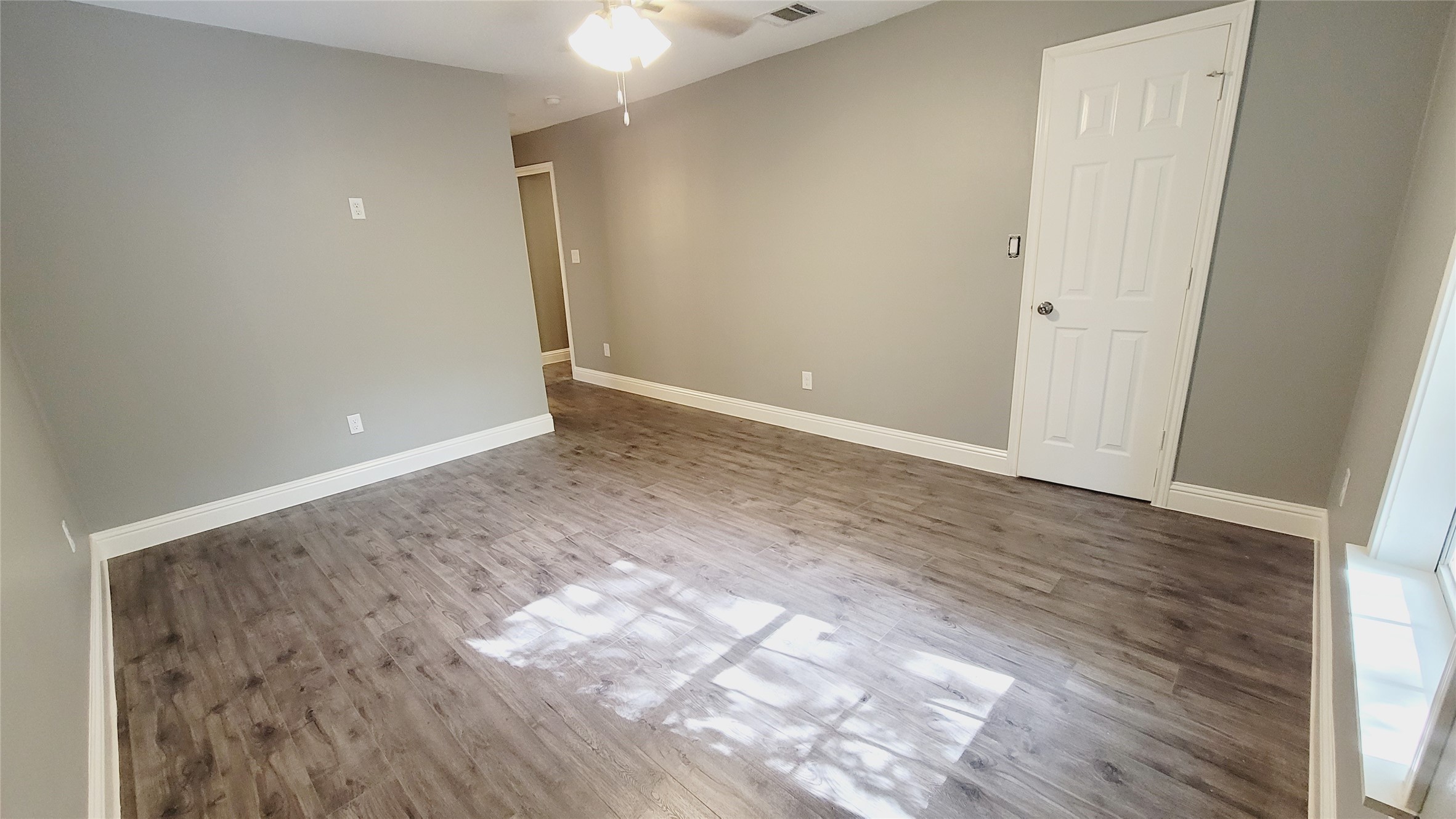 4034 Dreyfus Street Houston, TX 77021 - Photo 12 of 32 wooden floor in a hall with an entryway
