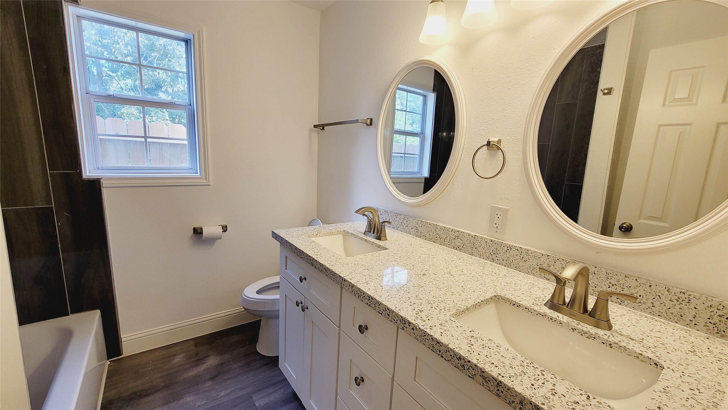 4034 Dreyfus Street Houston, TX 77021 - Photo 14 of 32 a bathroom with a granite countertop sink and a mirror