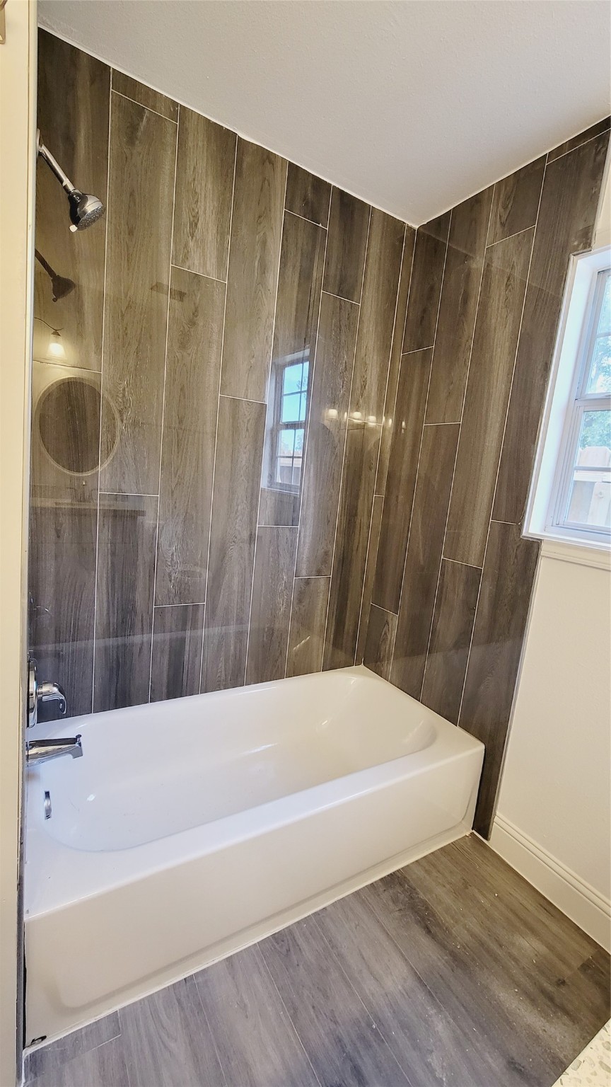 4034 Dreyfus Street Houston, TX 77021 - Photo 15 of 32 a bathroom with a bathtub and a shower