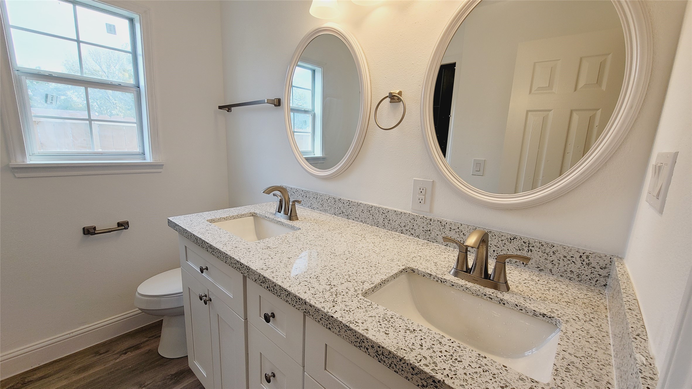4034 Dreyfus Street Houston, TX 77021 - Photo 23 of 32 a bathroom with a granite countertop sink and a mirror