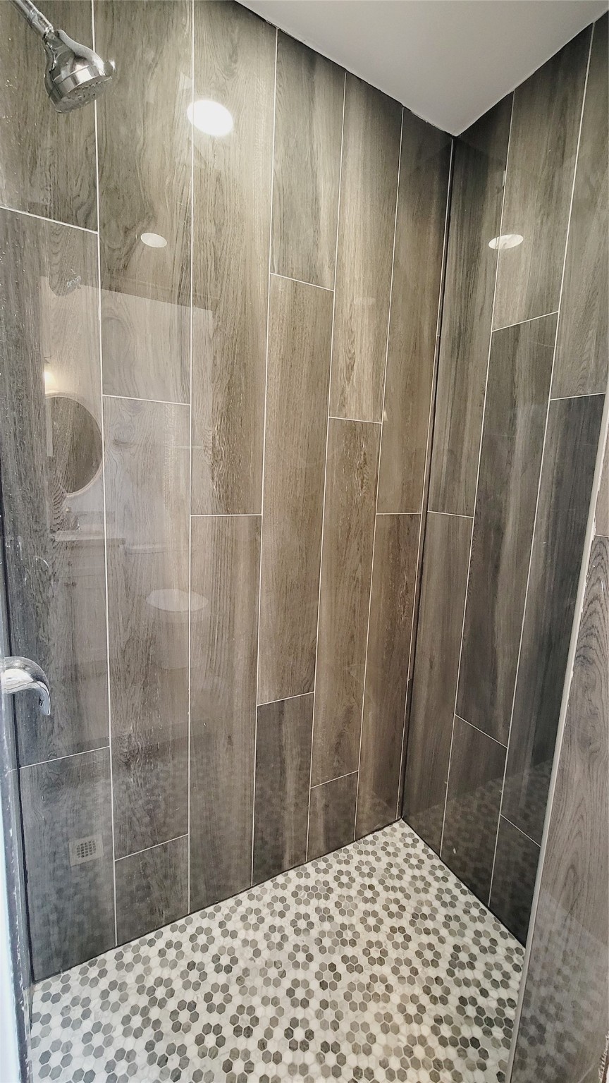 4034 Dreyfus Street Houston, TX 77021 - Photo 25 of 32 a bathroom with a shower and a sink