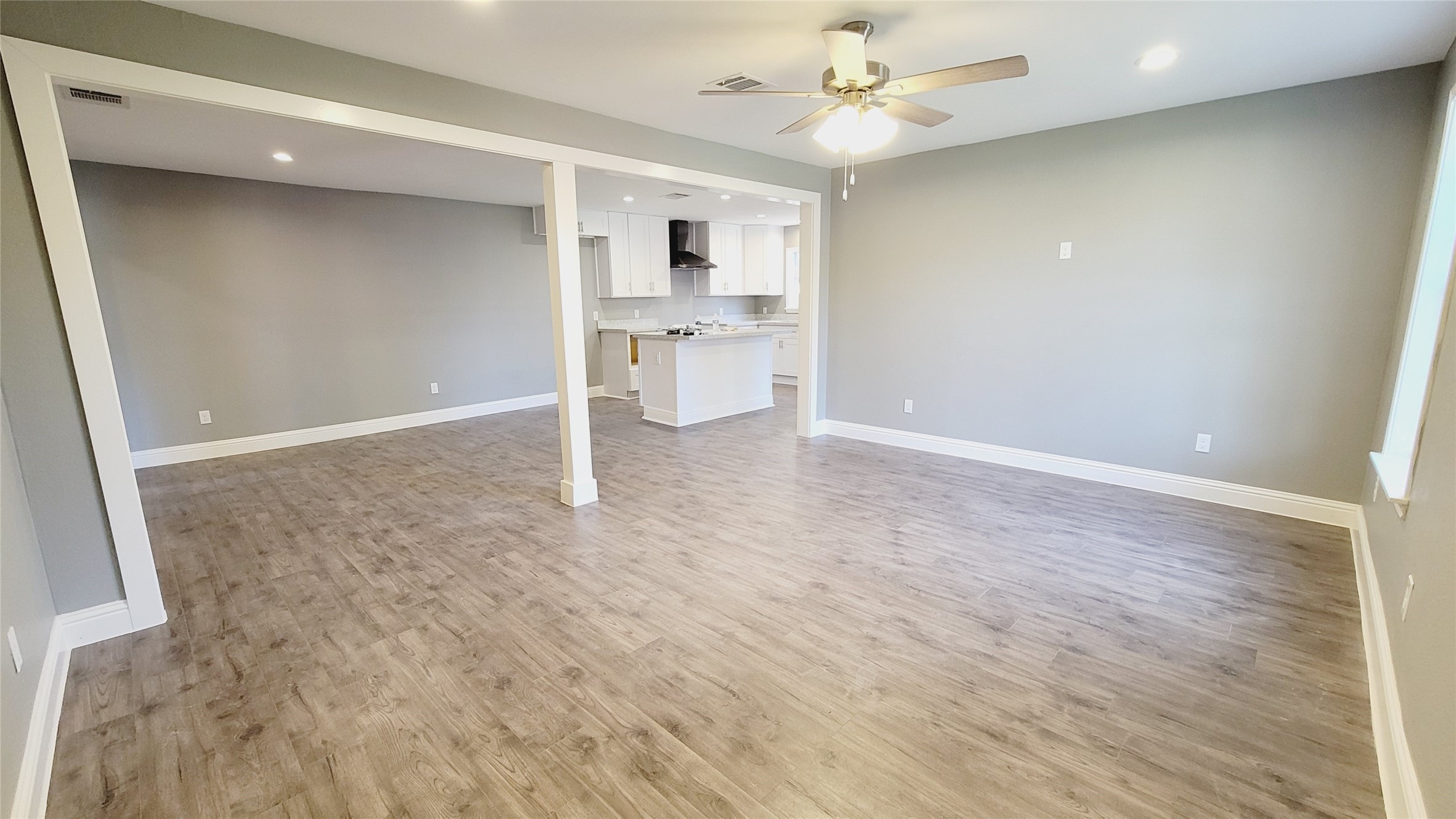 4034 Dreyfus Street Houston, TX 77021 - Photo 3 of 32 wooden floor in an empty room with a kitchen