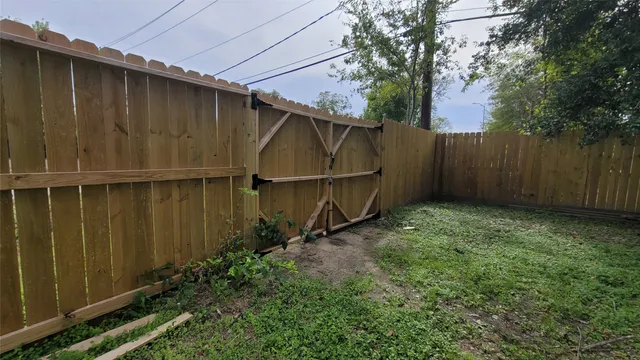 a view of backyard with a car parked
