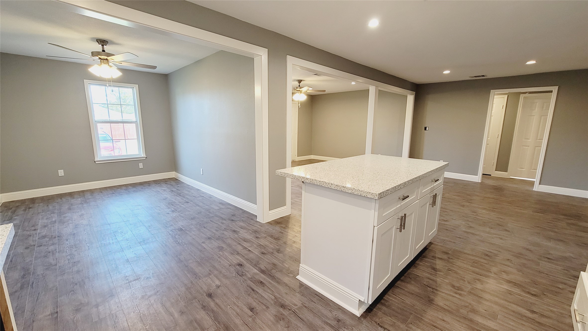 4034 Dreyfus Street Houston, TX 77021 - Photo 7 of 32 a utility room with wooden floor and window