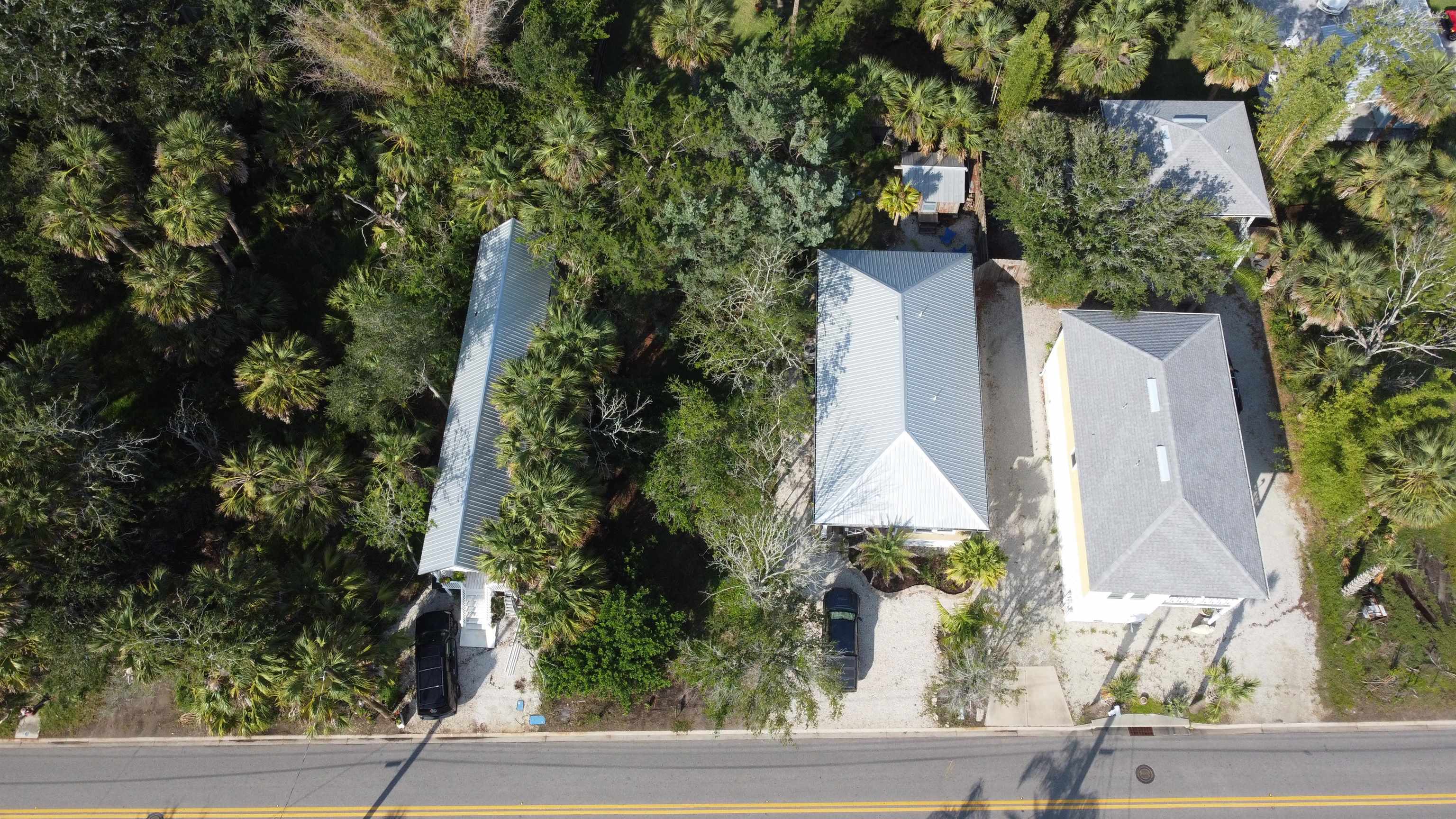 an aerial view of a house with yard