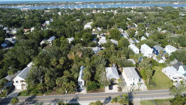 an aerial view of a house with yard