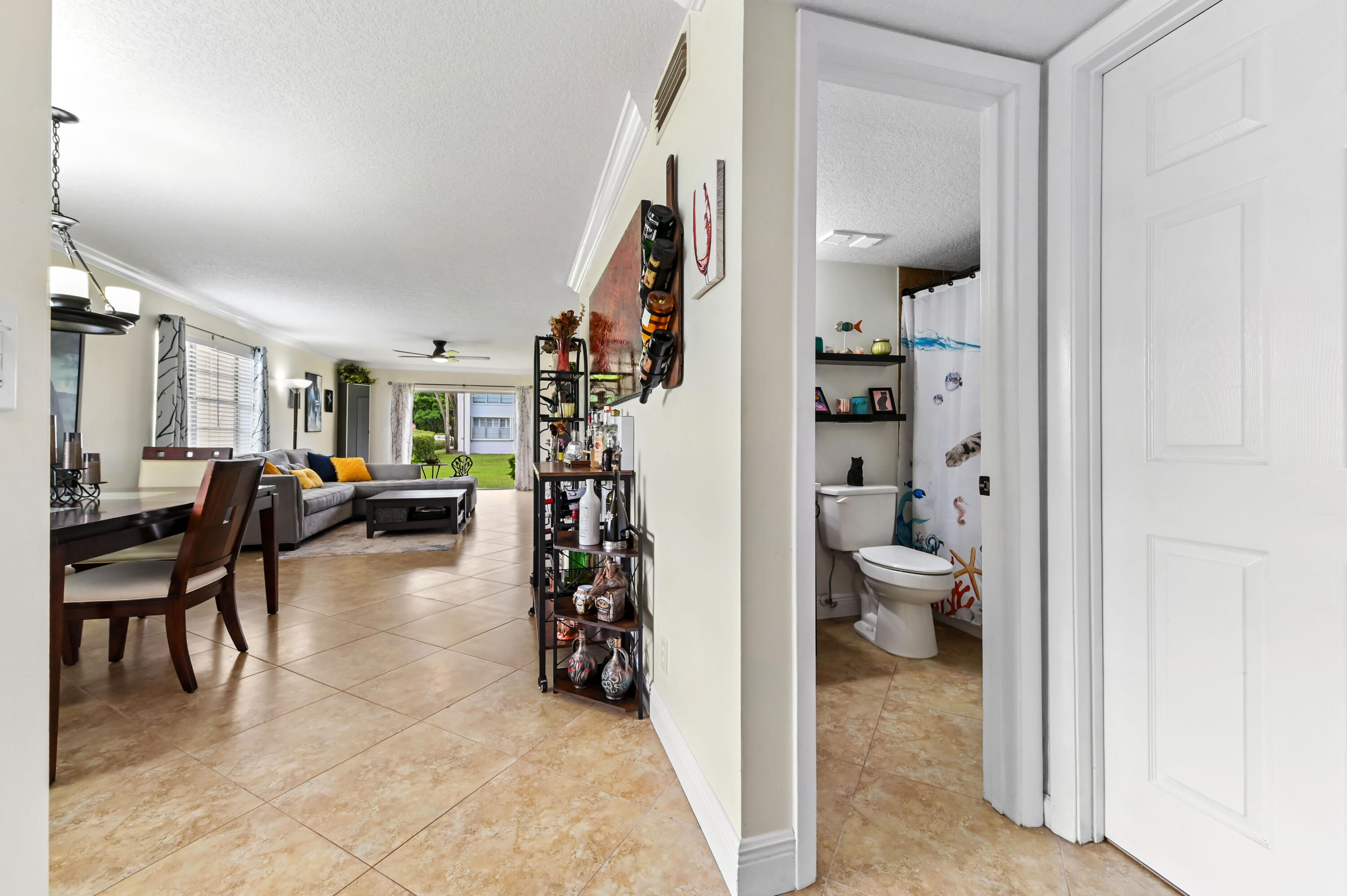 2905 Southwest 22nd Avenue, Unit 1080 Delray Beach, FL 33445 - Photo 12 of 33 a living room with furniture and a area