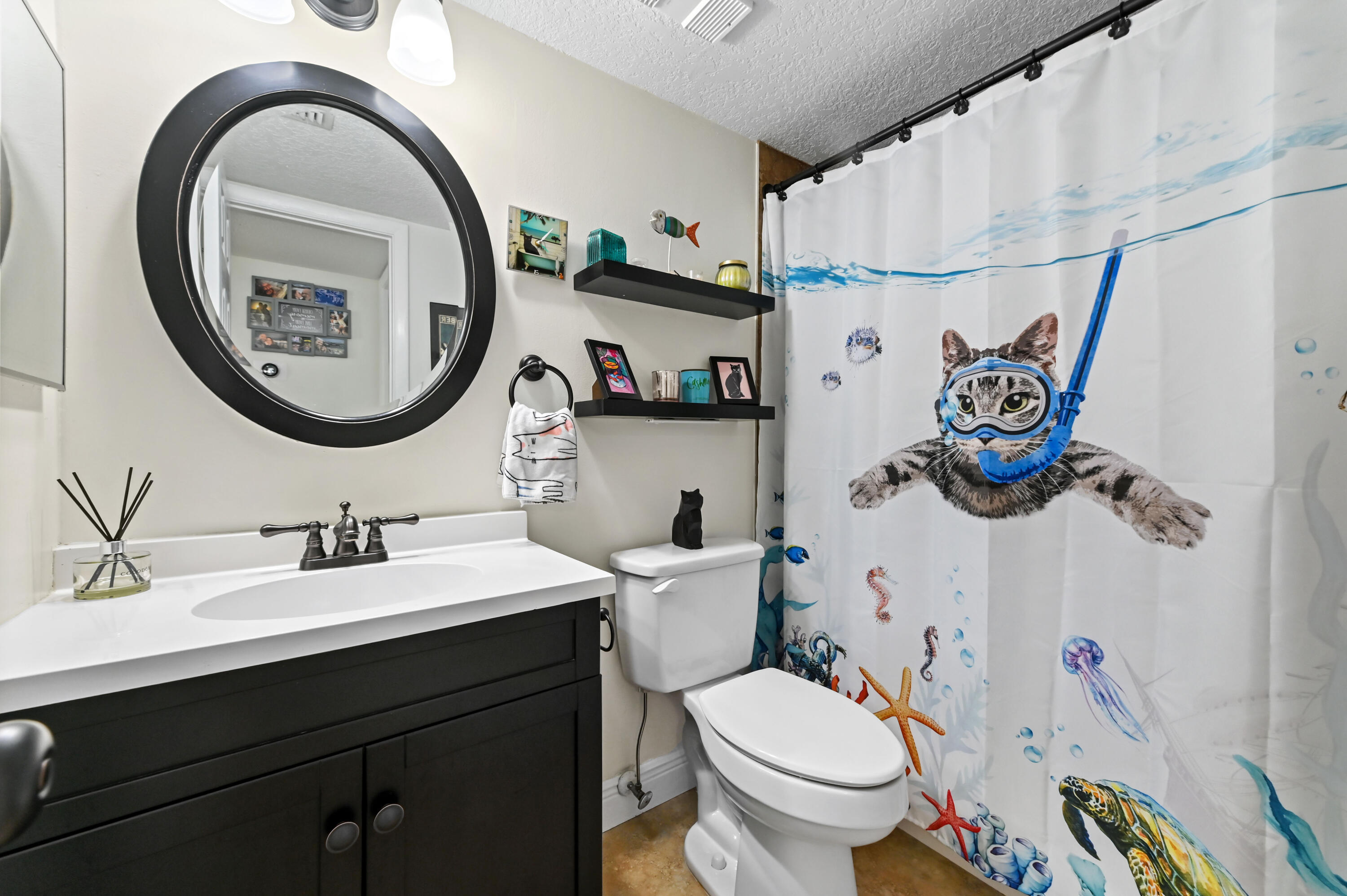 2905 Southwest 22nd Avenue, Unit 1080 Delray Beach, FL 33445 - Photo 13 of 33 a bathroom with a toilet a sink and a mirror