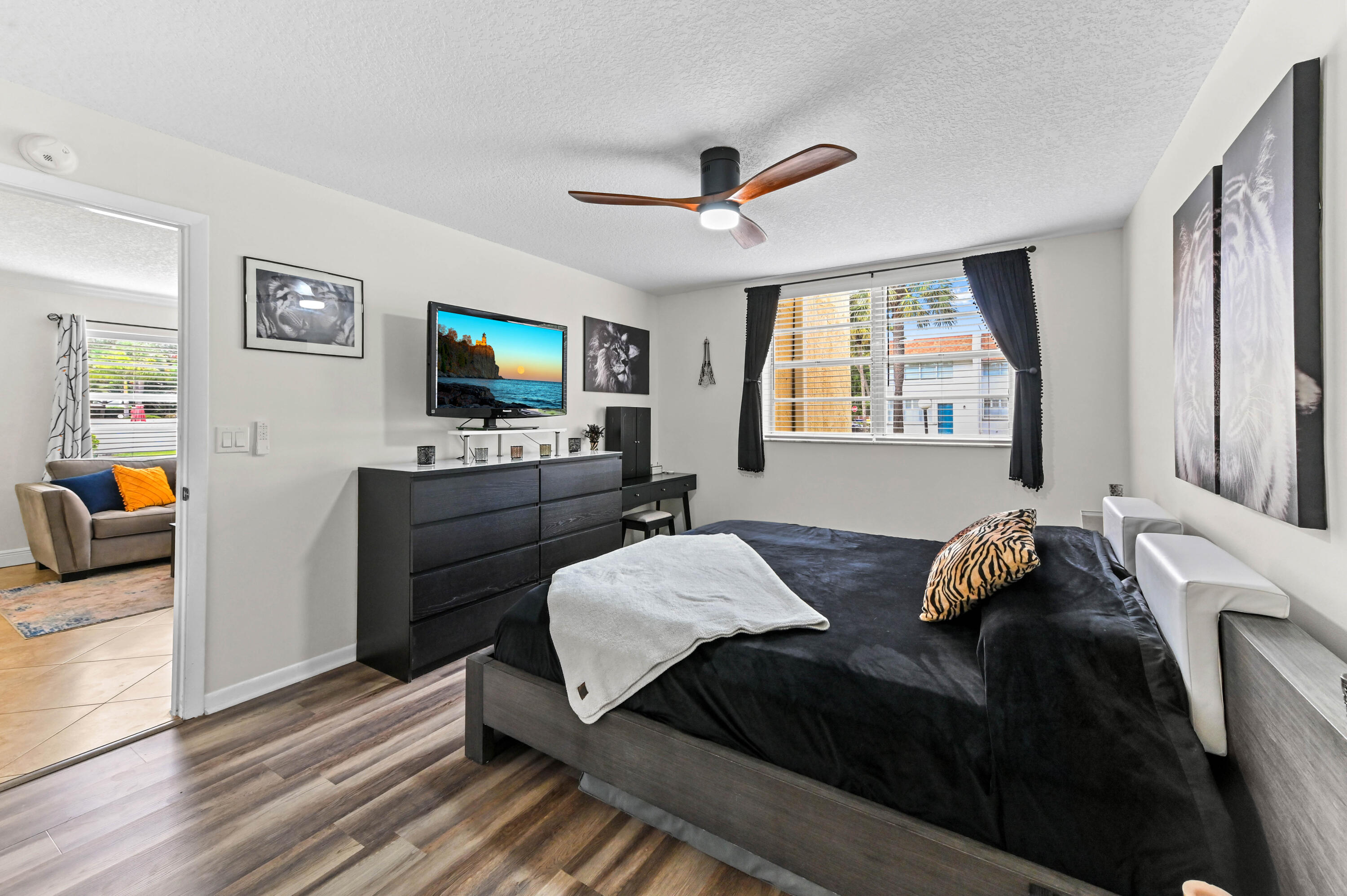 2905 Southwest 22nd Avenue, Unit 1080 Delray Beach, FL 33445 - Photo 21 of 33 a living room with furniture and a flat screen tv