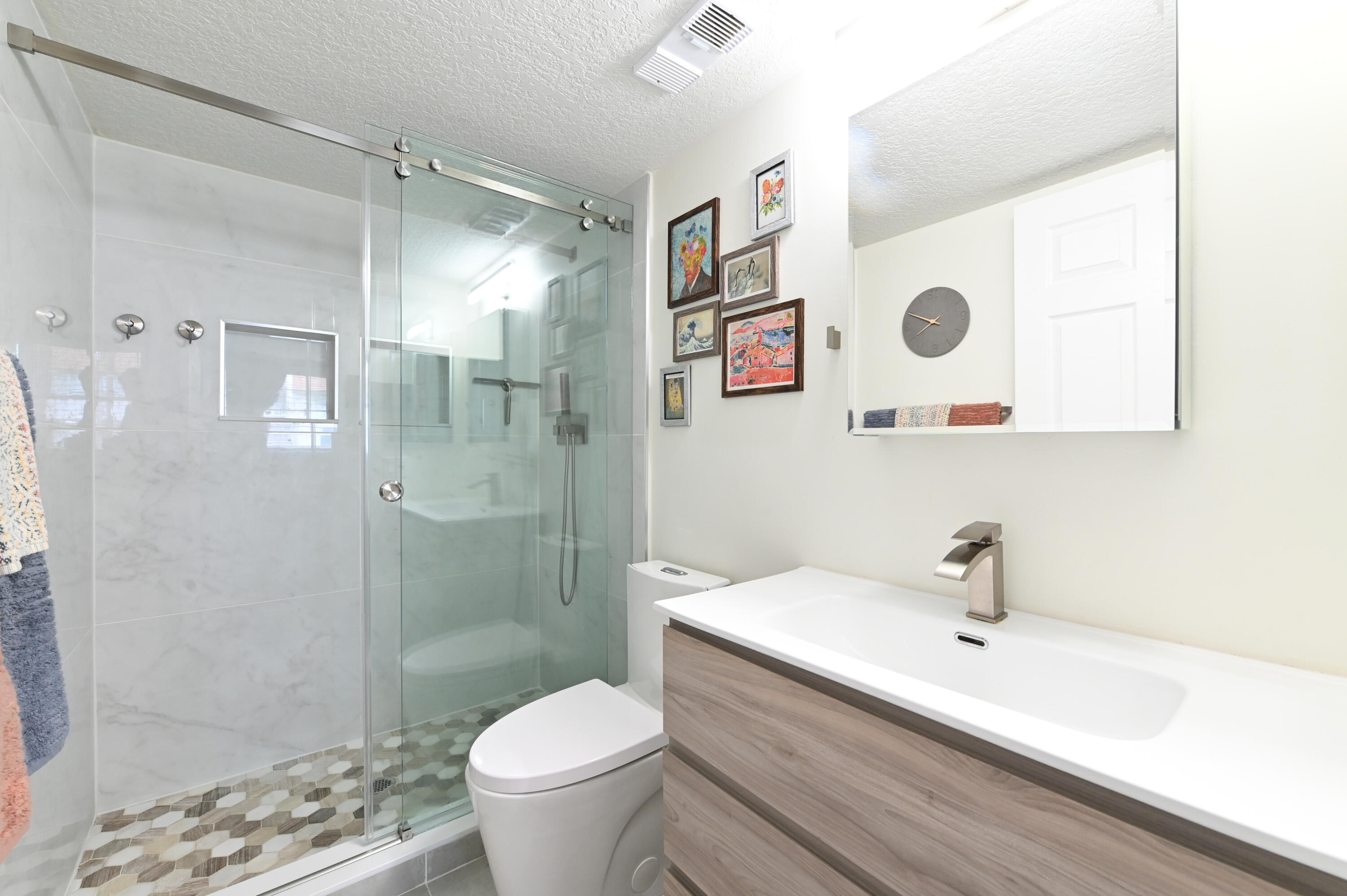 2905 Southwest 22nd Avenue, Unit 1080 Delray Beach, FL 33445 - Photo 23 of 33 a bathroom with a sink and a mirror
