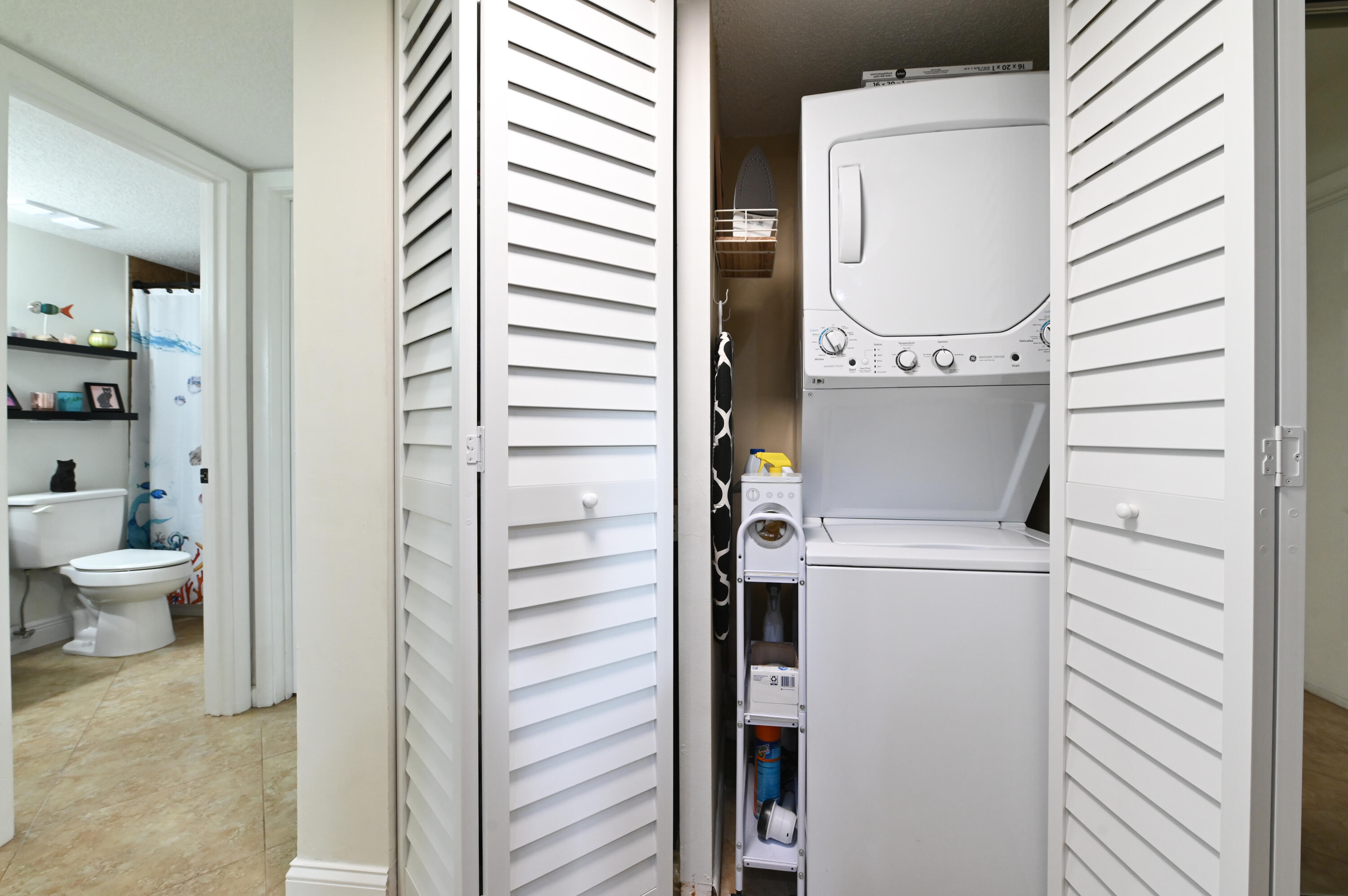2905 Southwest 22nd Avenue, Unit 1080 Delray Beach, FL 33445 - Photo 24 of 33 a view of bathroom with a toilet and a shower