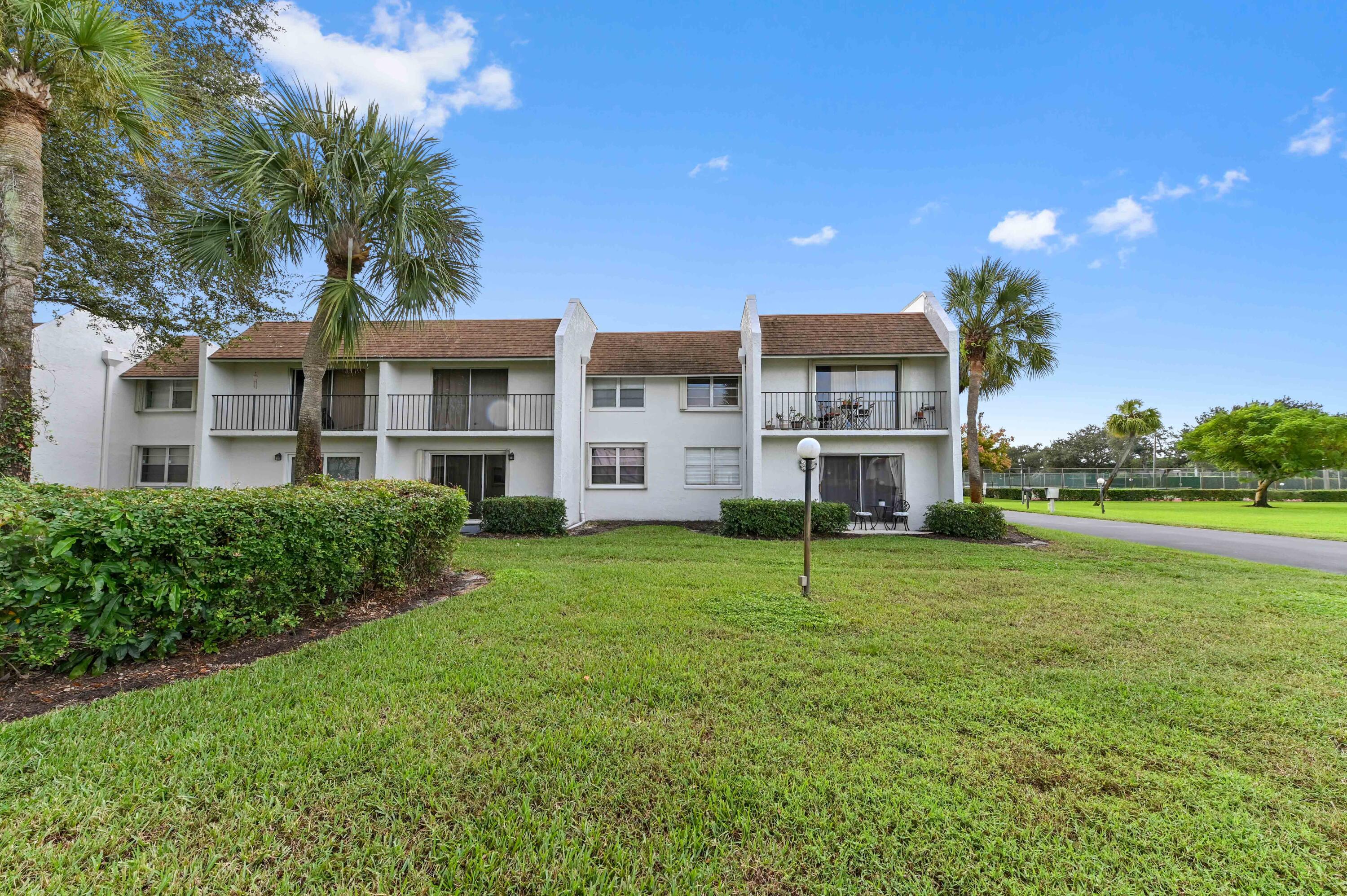 2905 Southwest 22nd Avenue, Unit 1080 Delray Beach, FL 33445 - Photo 26 of 33 a house view with a garden space