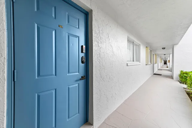 a view of a hallway with an entryway