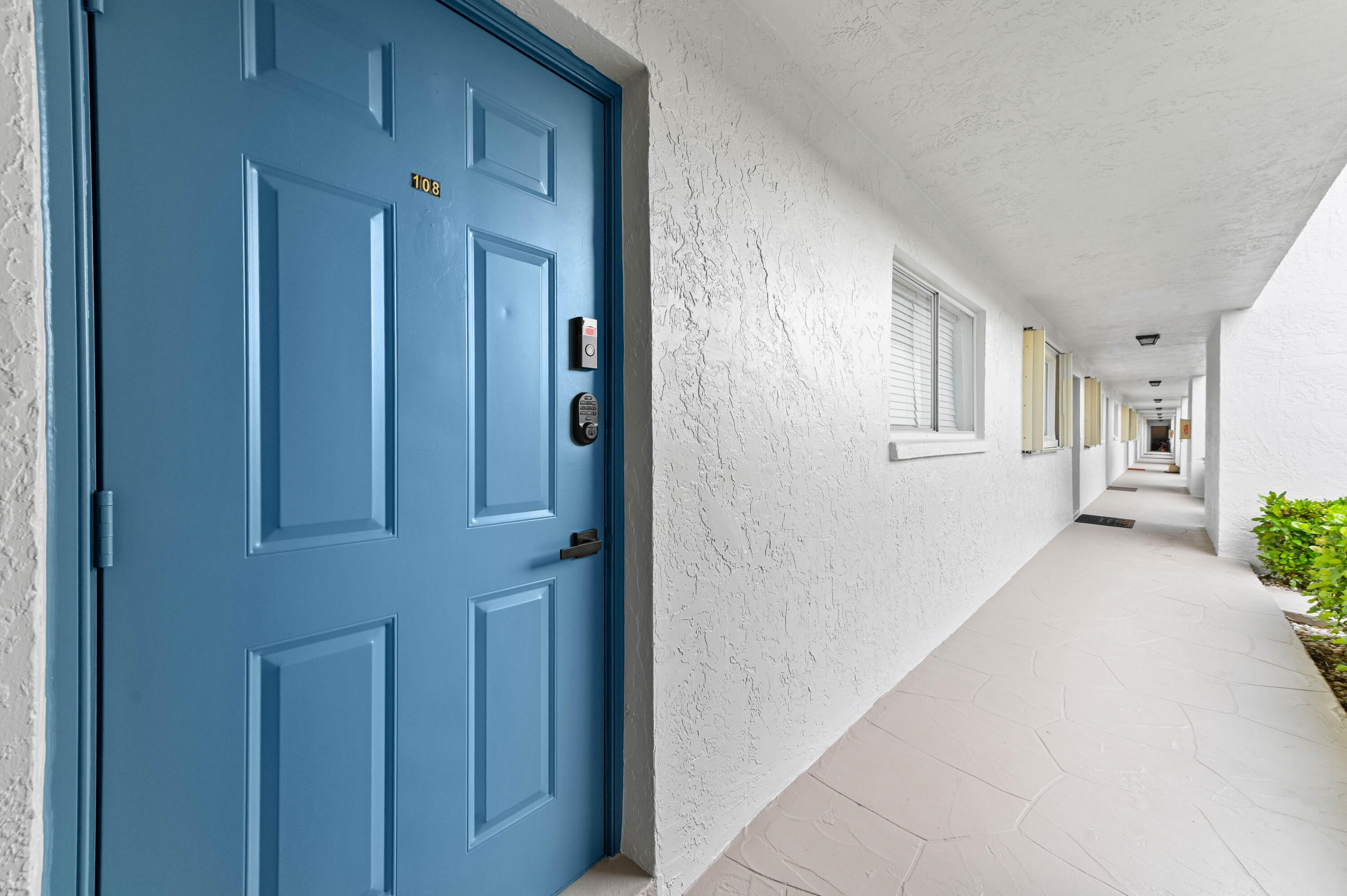 2905 Southwest 22nd Avenue, Unit 1080 Delray Beach, FL 33445 - Photo 5 of 33 a view of a hallway with an entryway