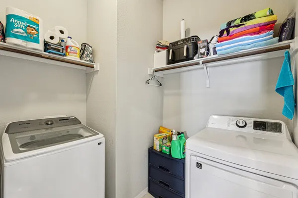 a view of a workspace with a bookshelf