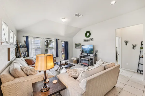 a living room with furniture and a rug