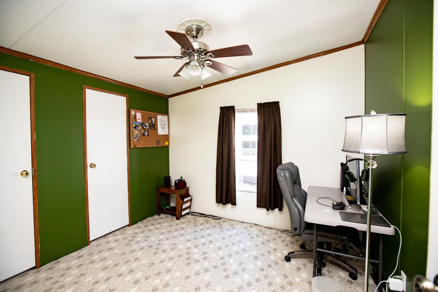 484 Old Oak Road Prospect, VA 23960 - Photo 16 of 20 a bedroom with a bed and a desk