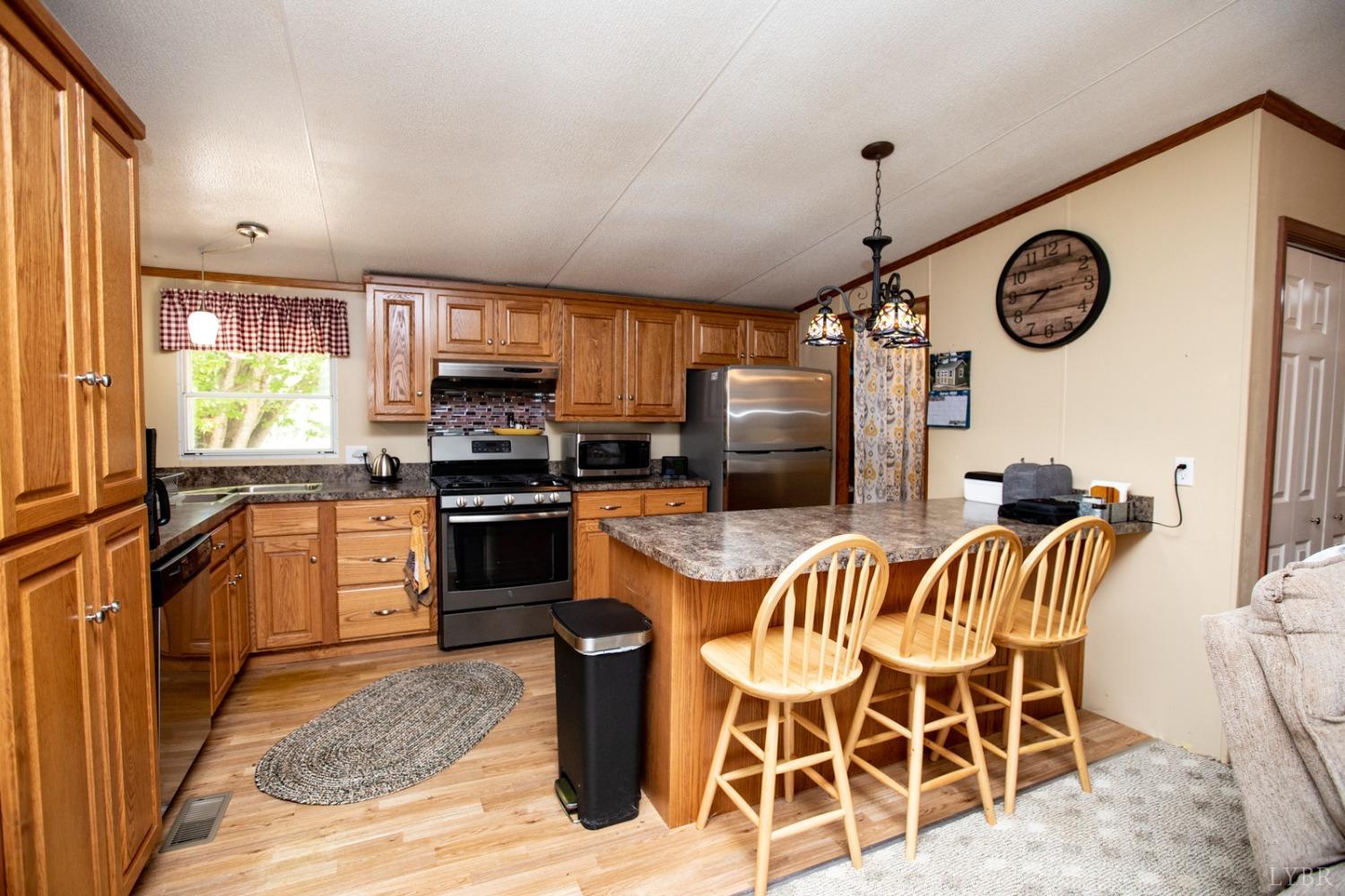 484 Old Oak Road Prospect, VA 23960 - Photo 3 of 20 a kitchen with stainless steel appliances granite countertop a stove and a sink