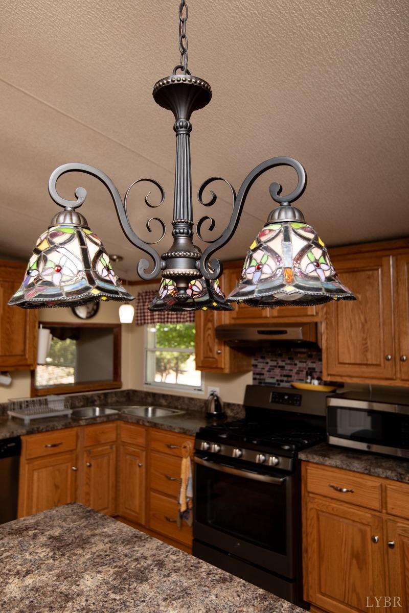 484 Old Oak Road Prospect, VA 23960 - Photo 6 of 20 a kitchen with a stove and cabinets