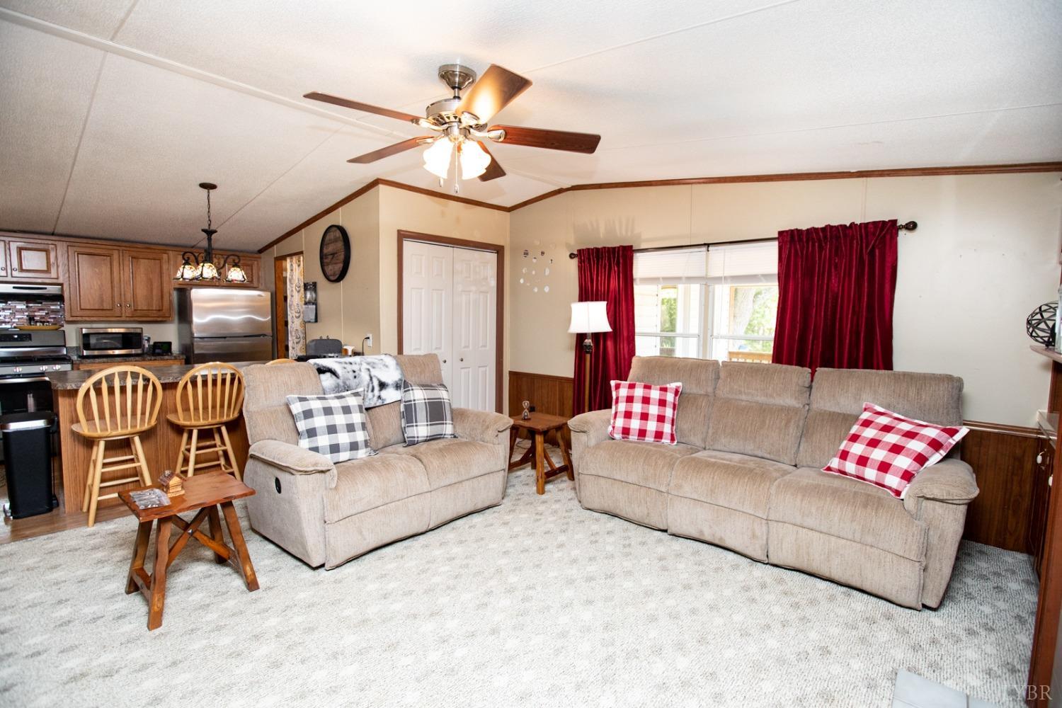 484 Old Oak Road Prospect, VA 23960 - Photo 9 of 20 a living room with furniture kitchen view and a chandelier