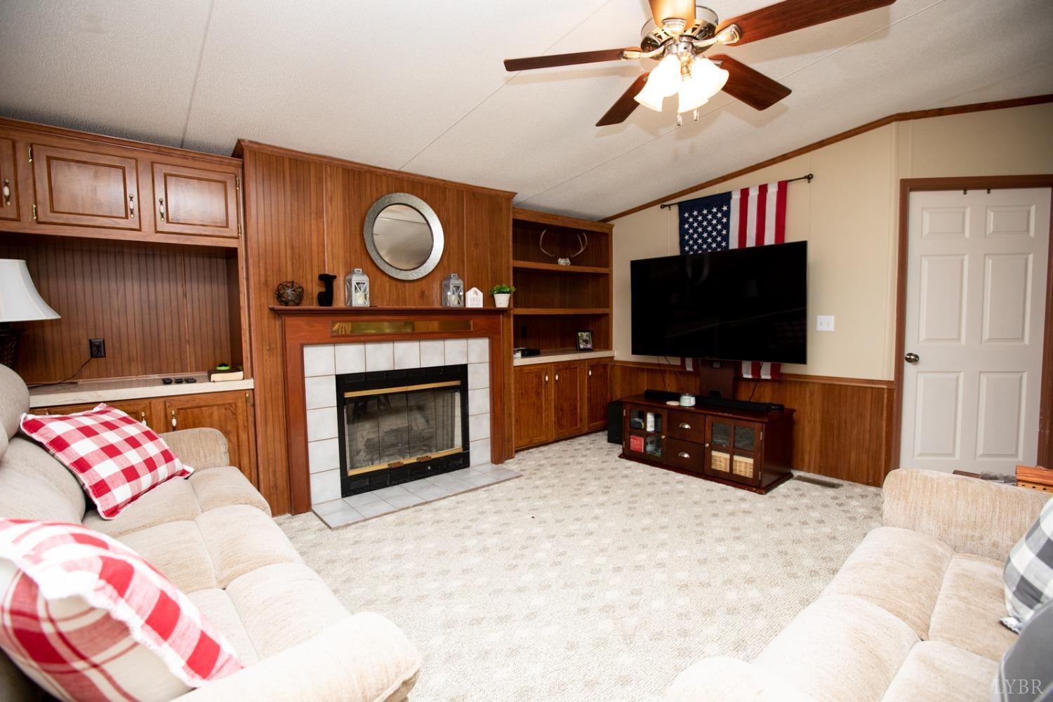 484 Old Oak Road Prospect, VA 23960 - Photo 10 of 20 a bedroom with a bed and a flat screen tv