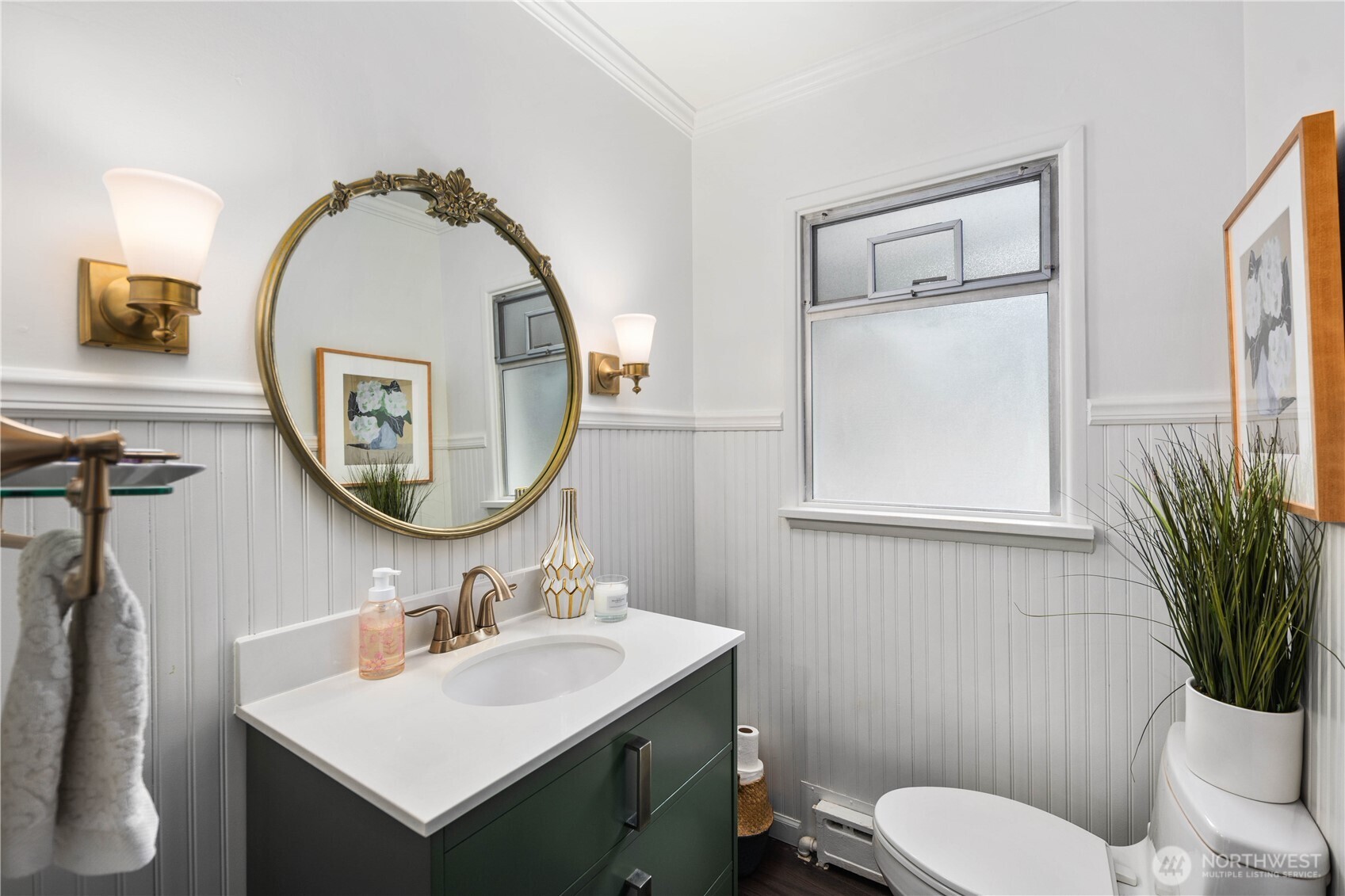 641 Northwest 175th Street Shoreline, WA 98177 - Photo 16 of 40 a bathroom with a toilet a sink and a mirror