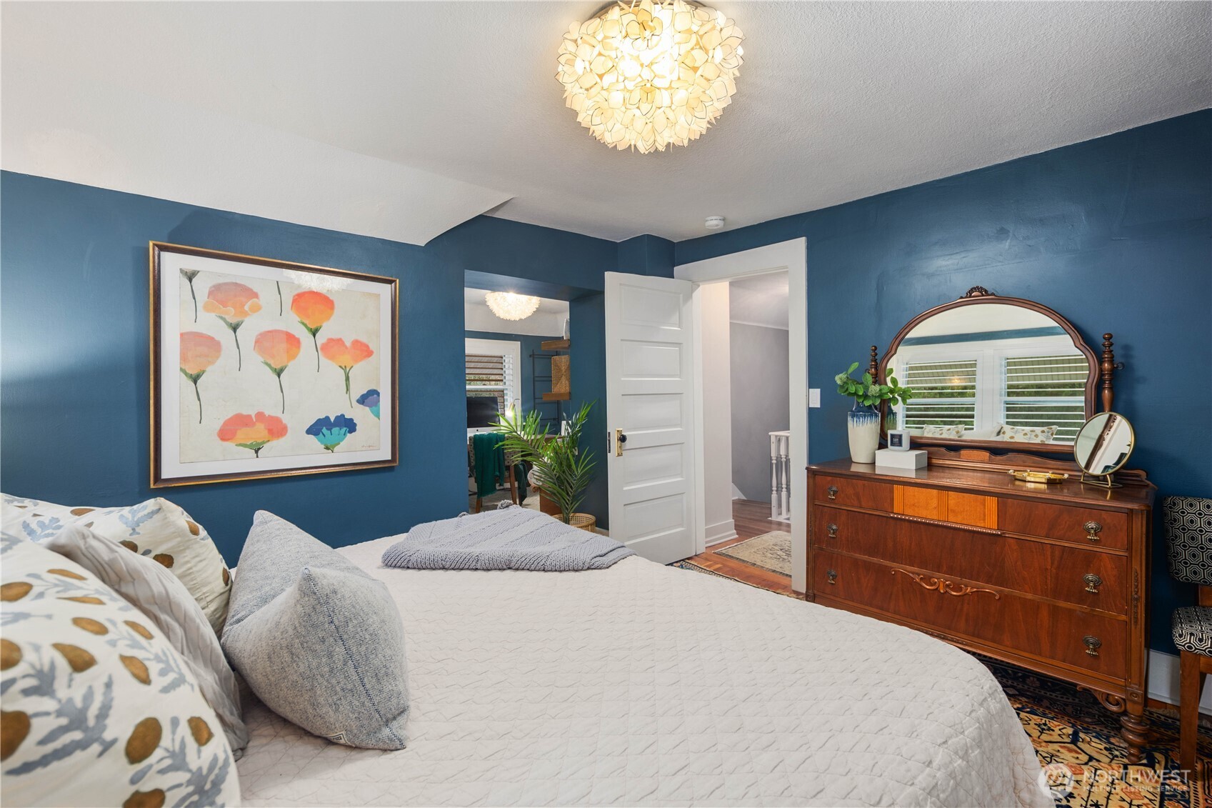 641 Northwest 175th Street Shoreline, WA 98177 - Photo 18 of 40 a bedroom with a bed and a dresser next to a window