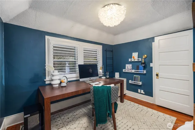 a reading room with furniture window and wooden floor