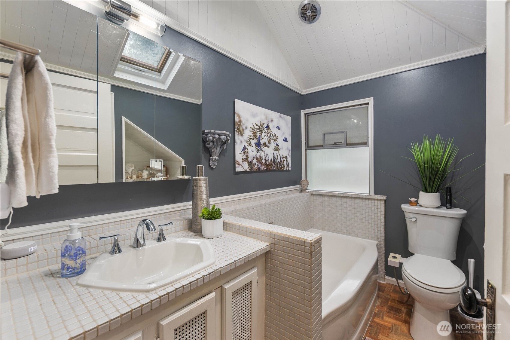 641 Northwest 175th Street Shoreline, WA 98177 - Photo 22 of 40 a bathroom with a granite countertop sink toilet and a large mirror
