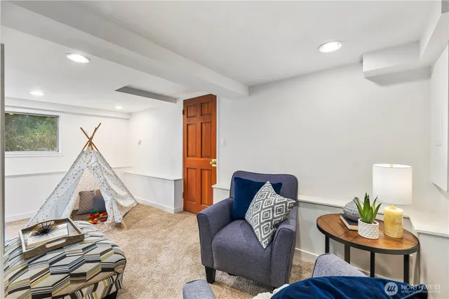 a living room with furniture and a gate